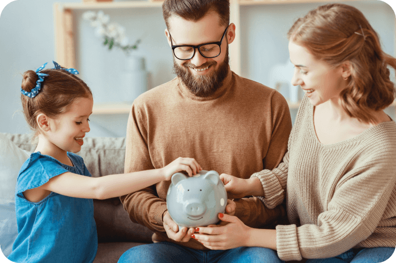 Family Holding A Piggy Bank