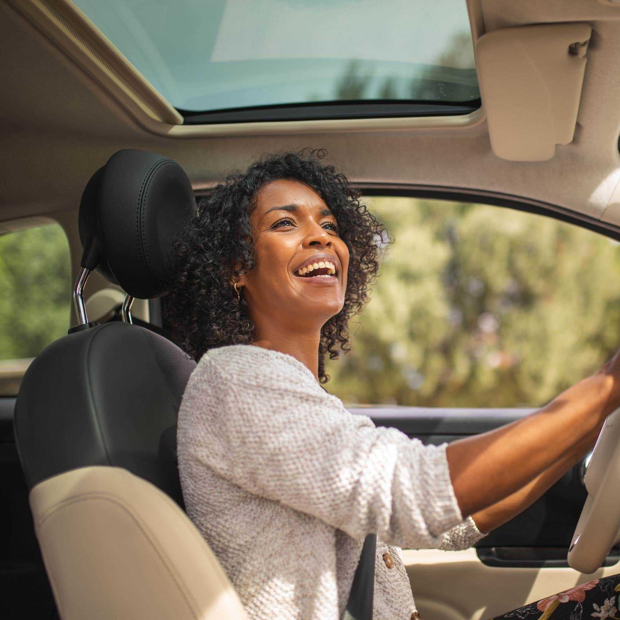 Happy lady in The Car