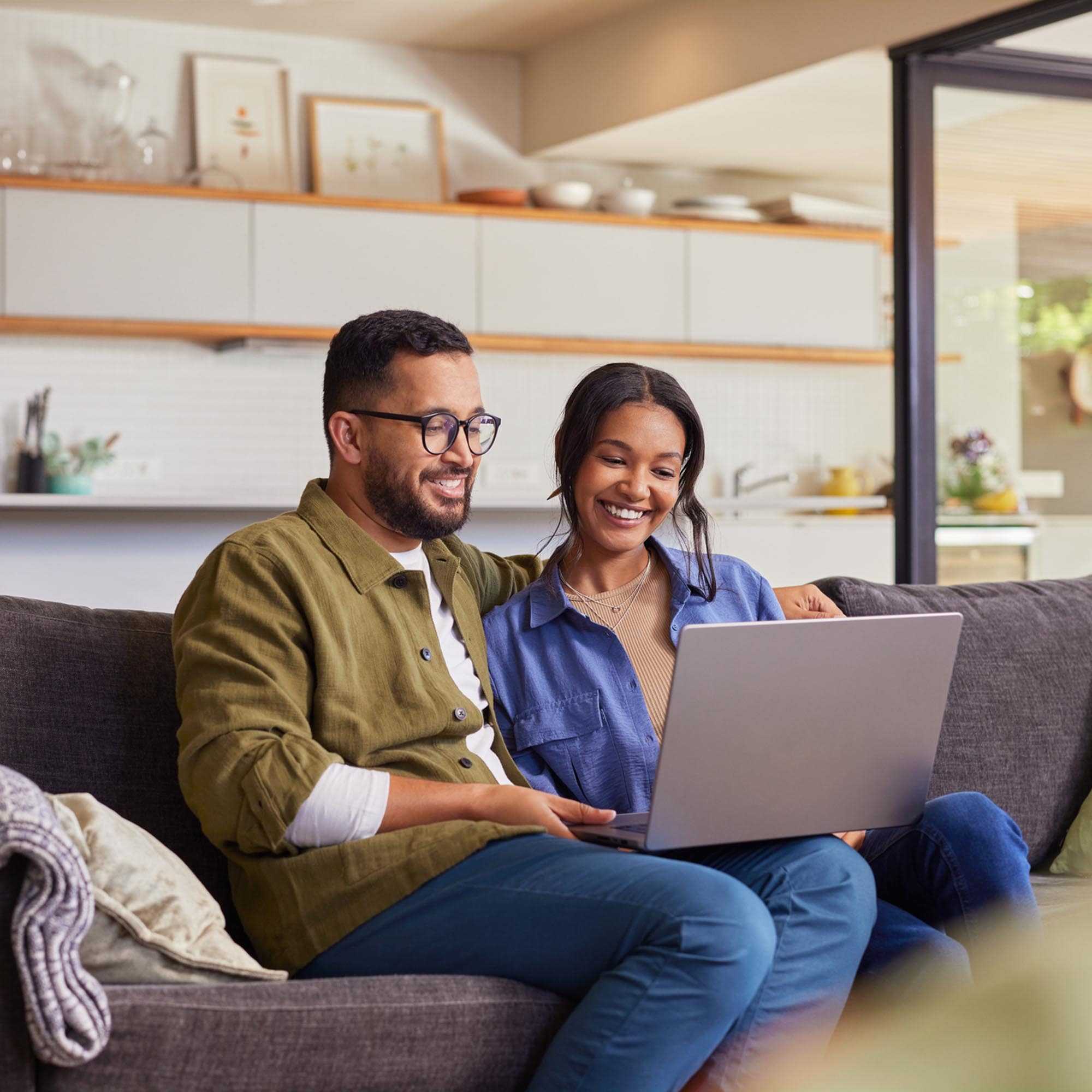 Happy Couple on Sofa at Home - Sudbury