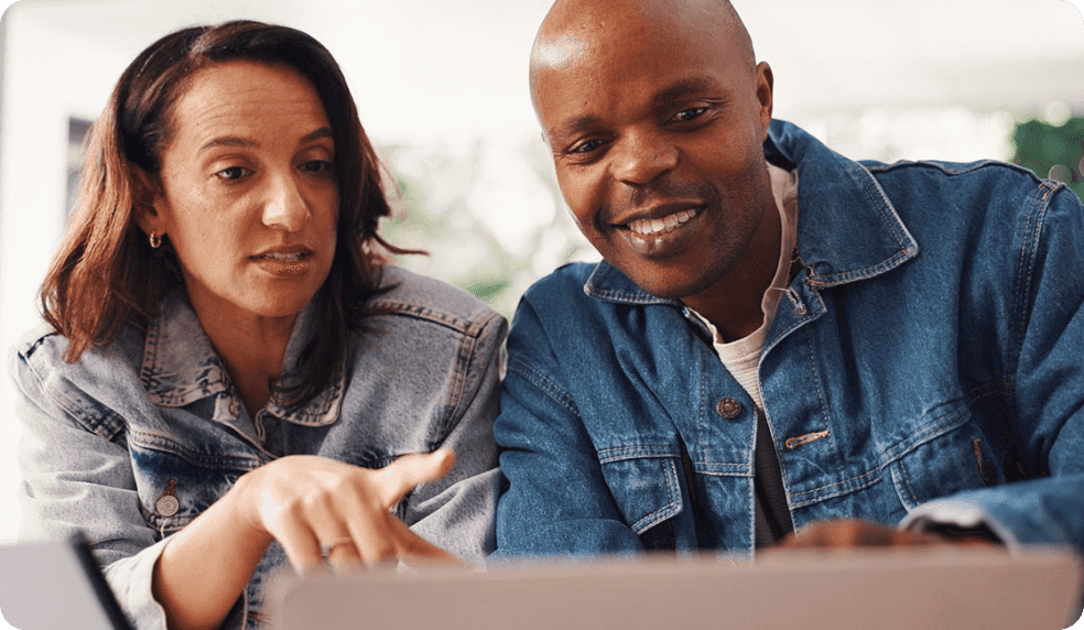 Couple looking at EQ Bank FAQs