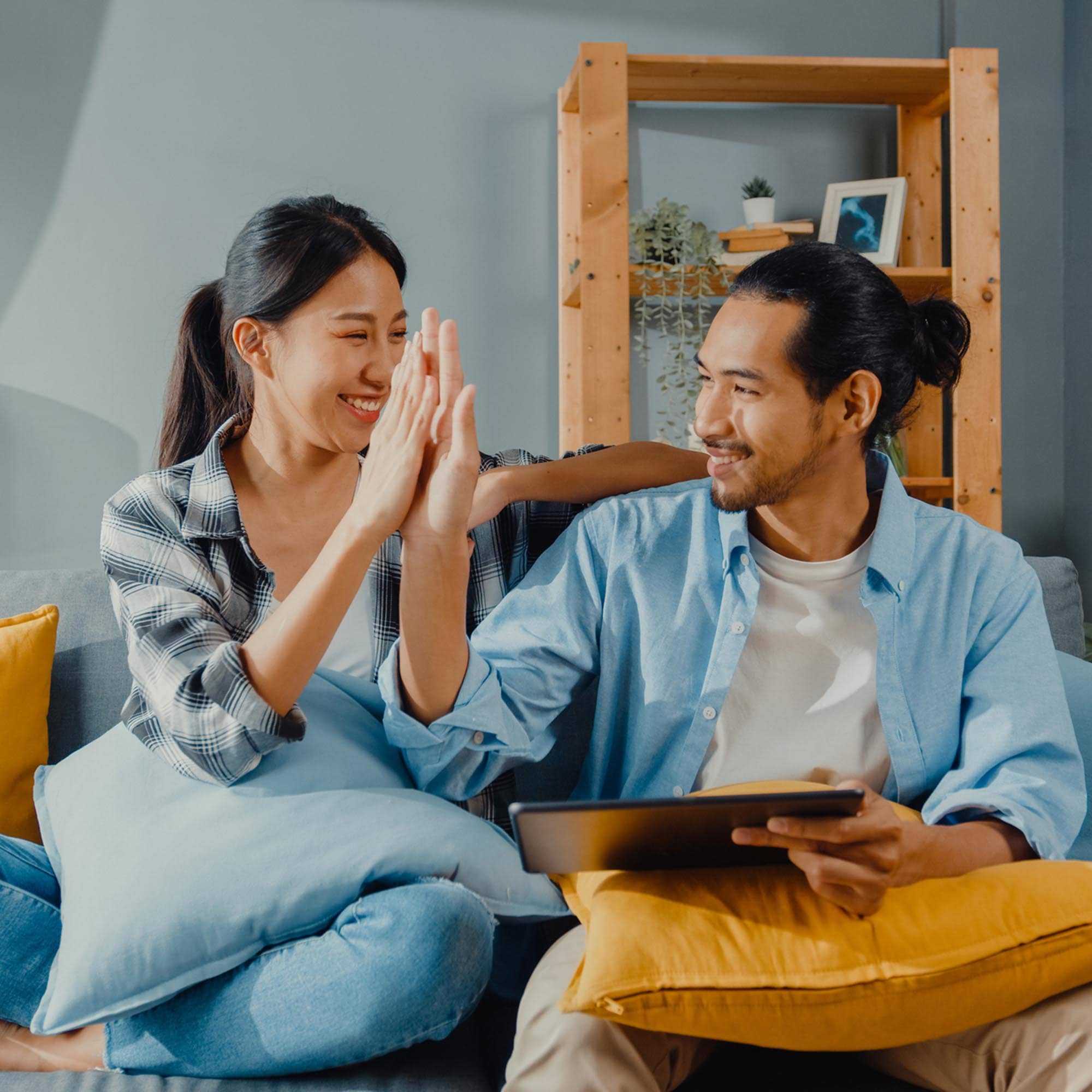 Couple High Five in the apartment - Brampton