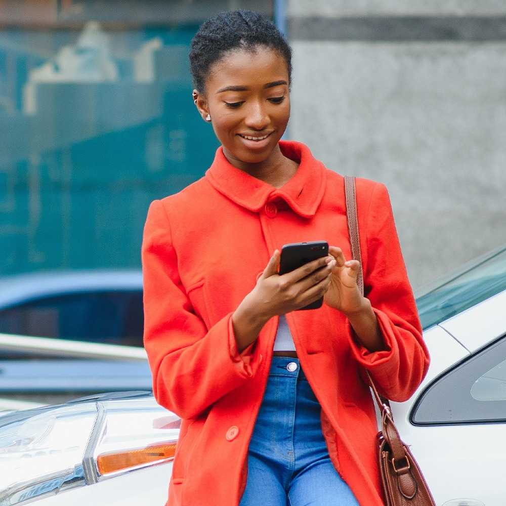 Lady with the phone and electric vehicle