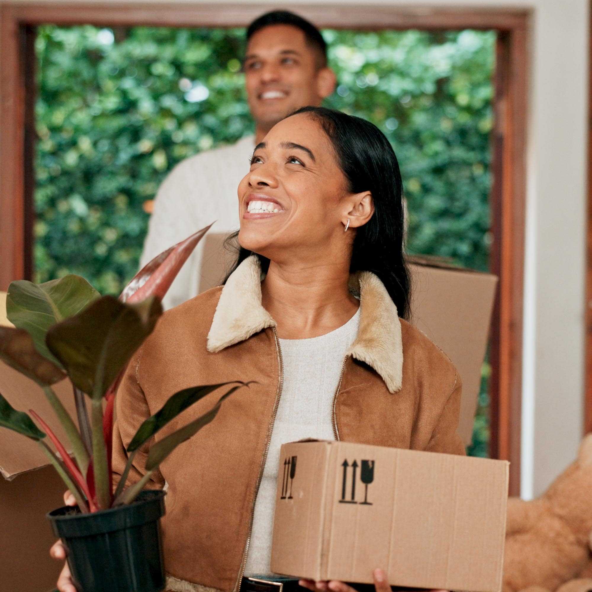 Couple Moving In with Boxes and Plants - Niagara Falls