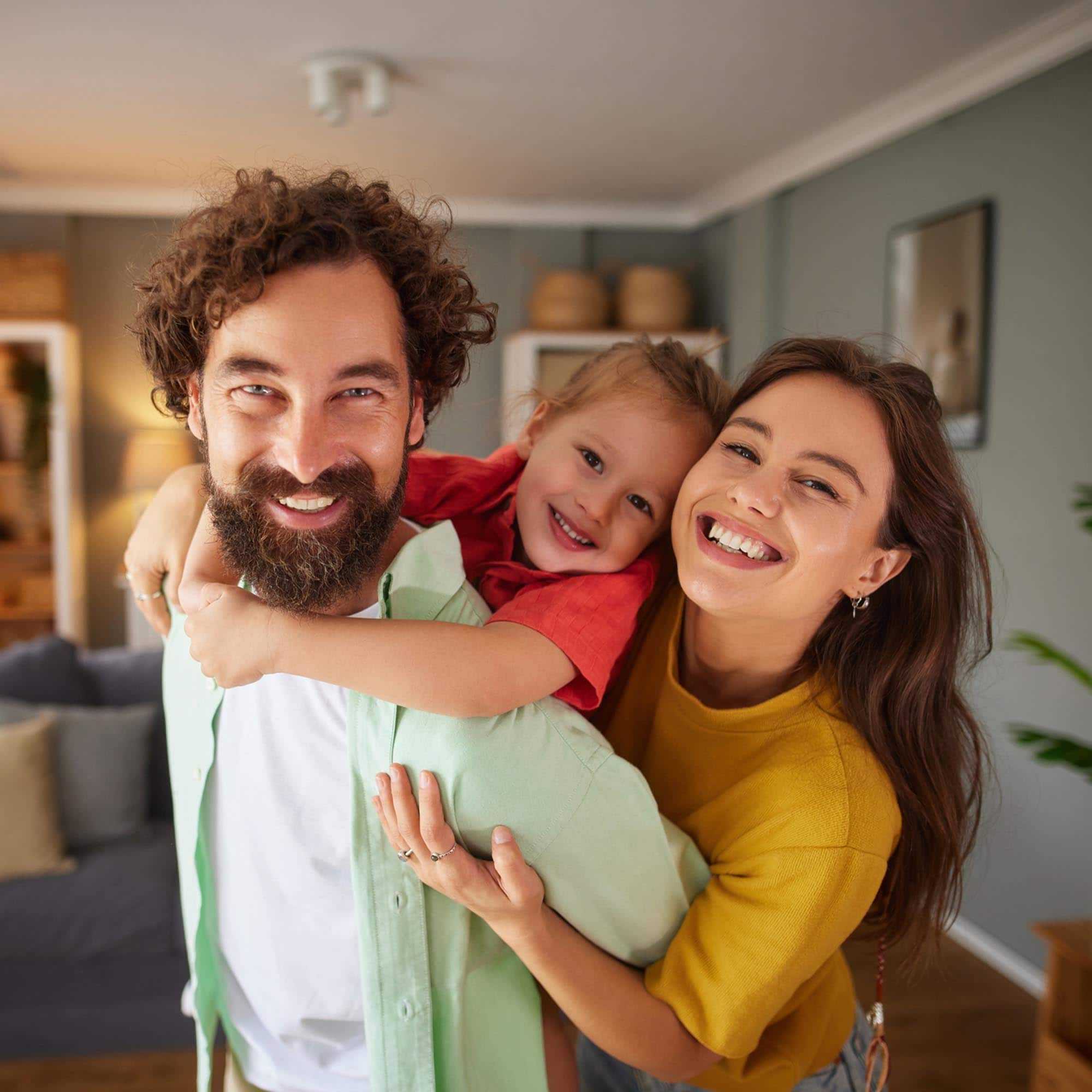 Happy Family Smiling in apartment - Kitchener