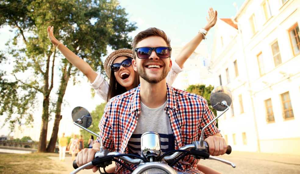 Couple is riding motorcycle